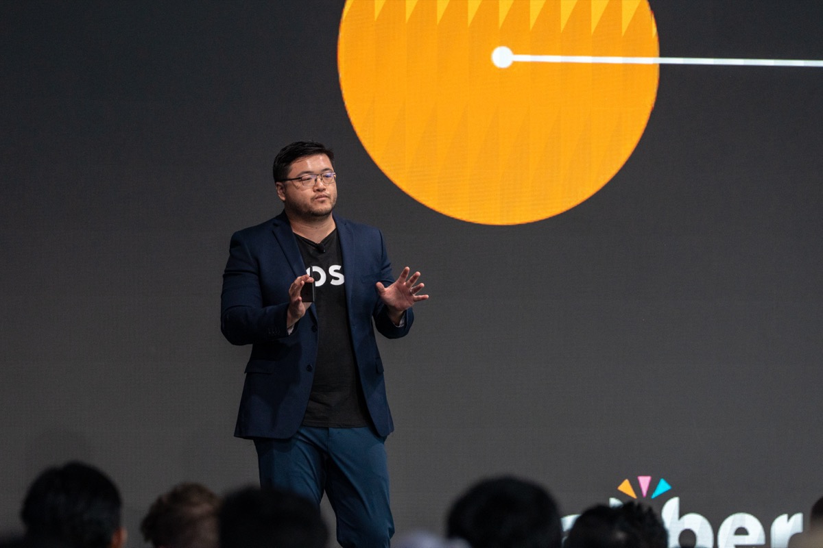 Robert Lai on stage at Ahrefs Evolve